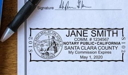 Notary public seal and signature on a signed document